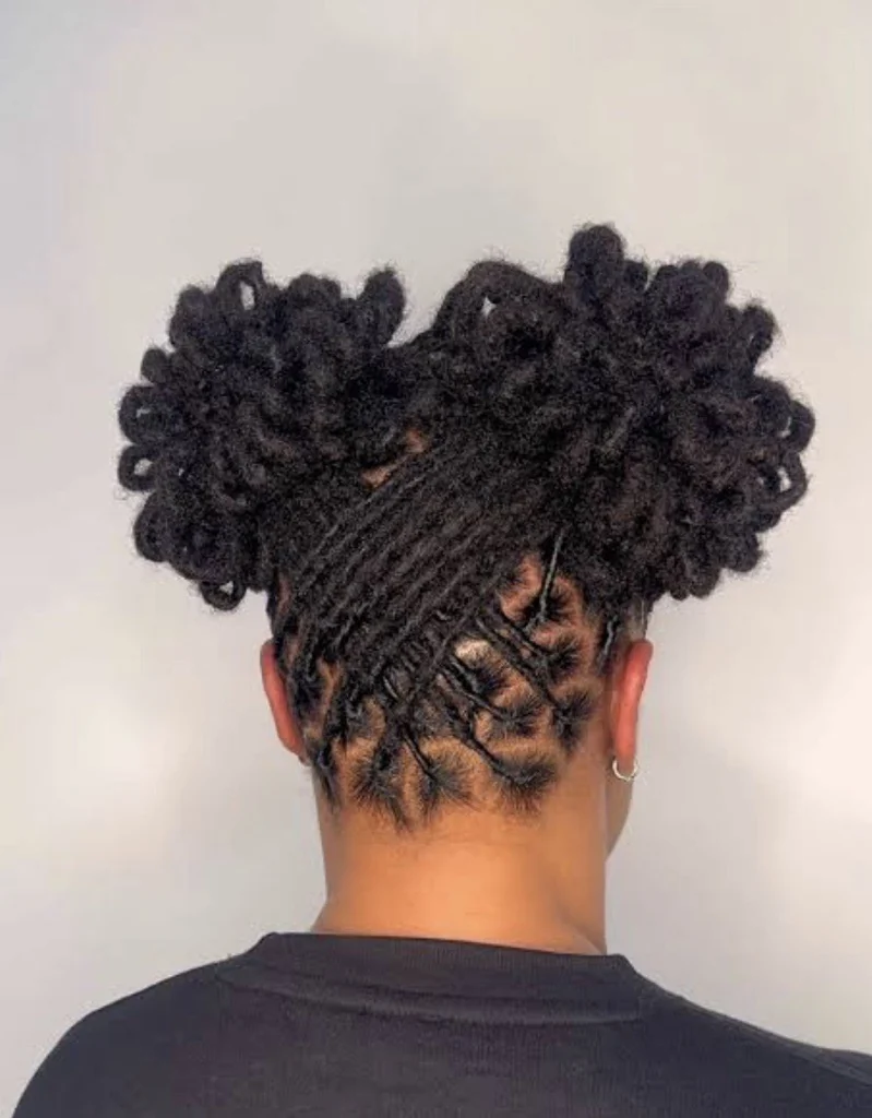 Loc updo with flower-bun detailing